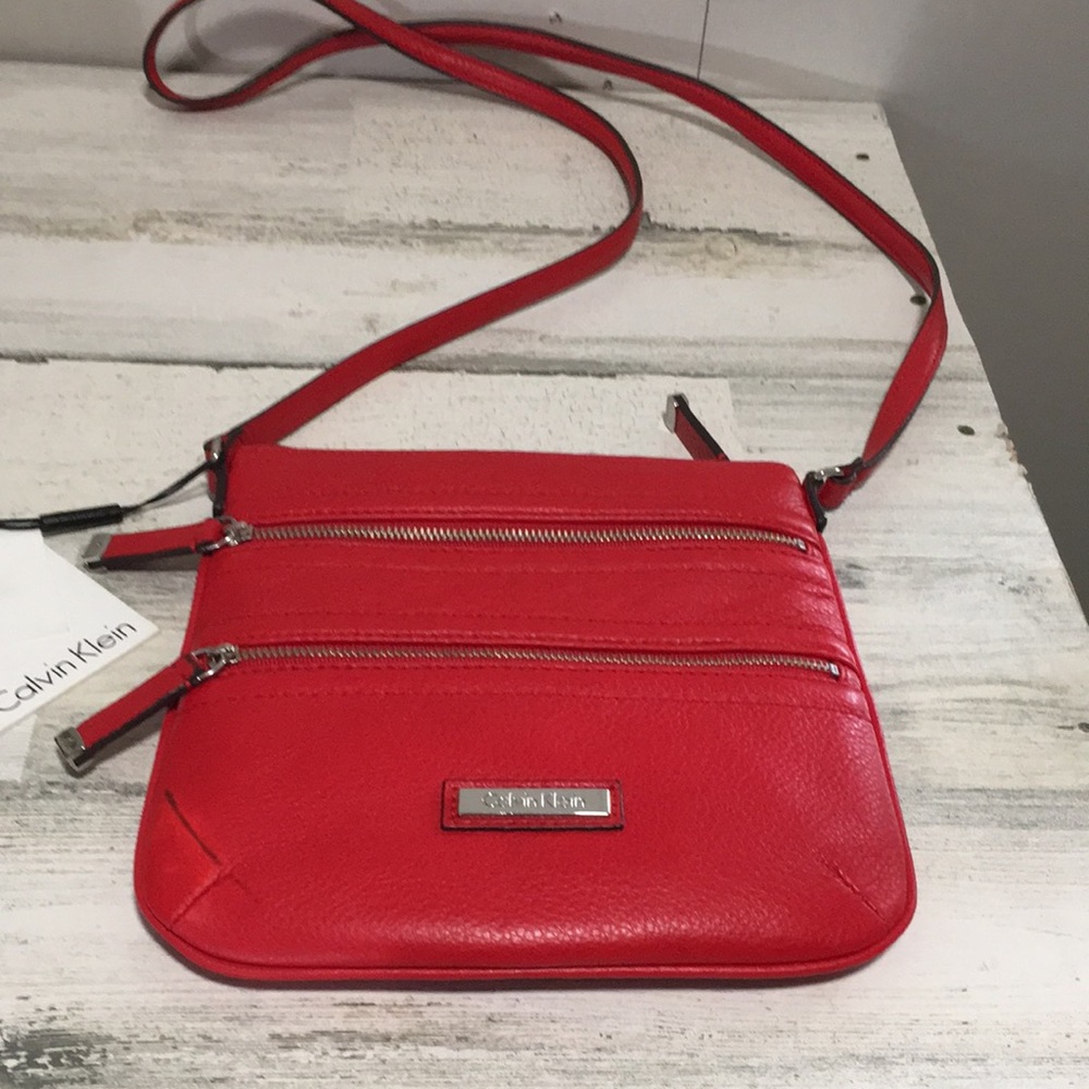 Calvin Klein woman’s lipstick red crossbody bag with two front zippers NWT